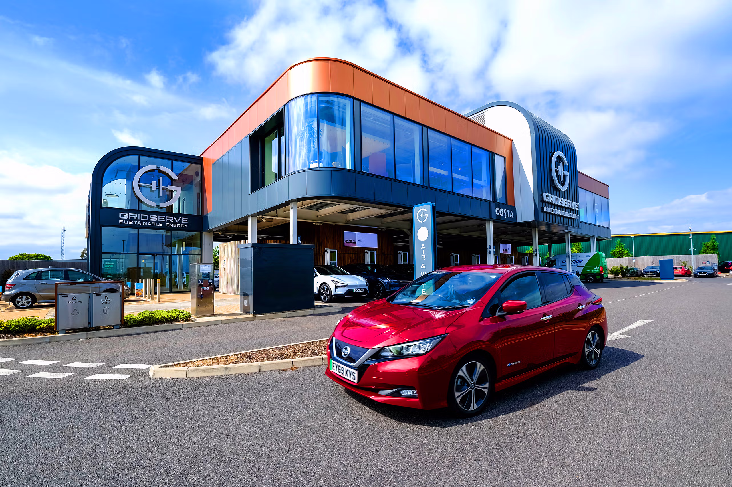 EV site photographer case study – aerial drone photograph of GRIDSERVE’s Norwich Electric Forecourt during a Polestar PR event.