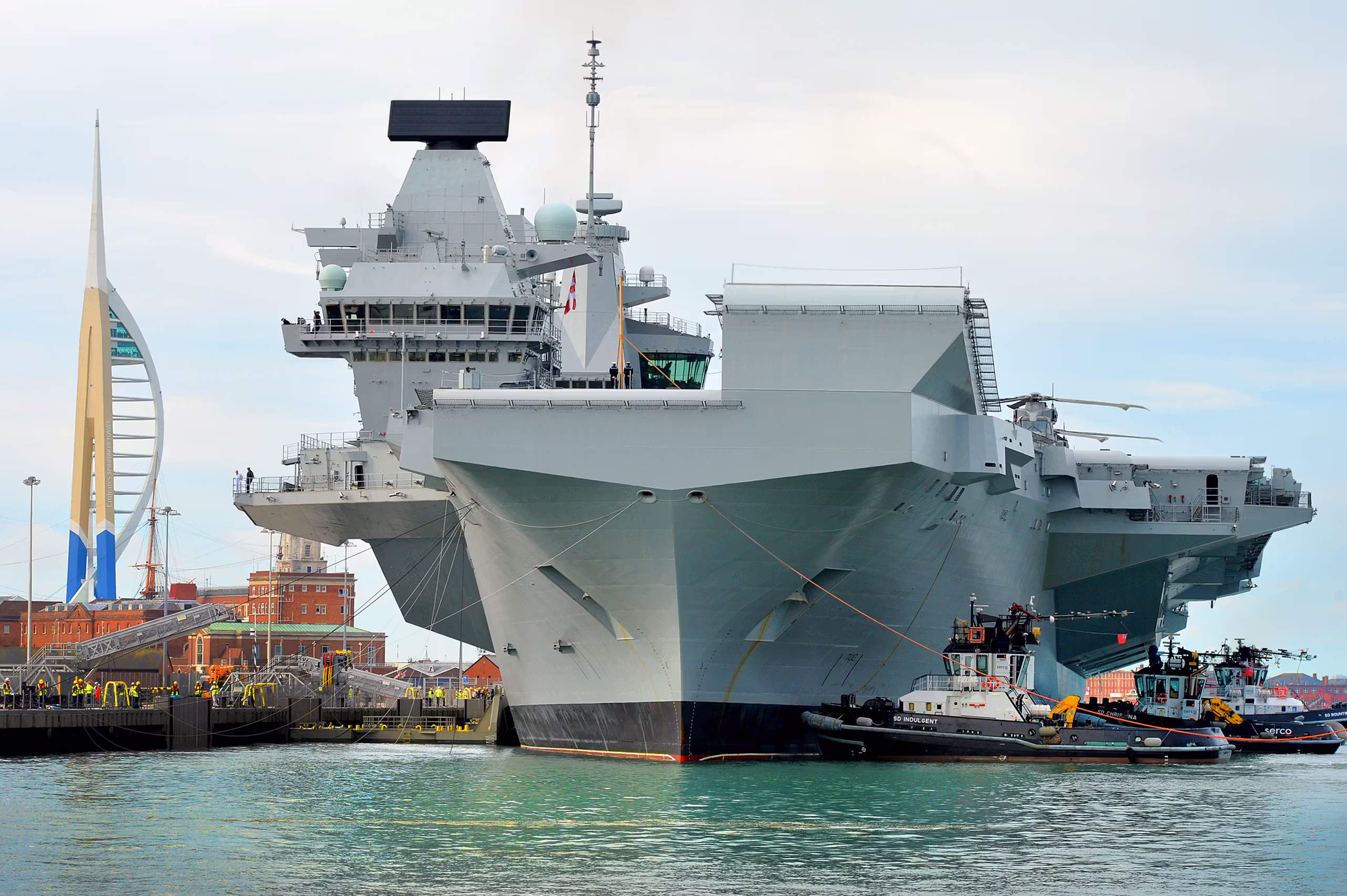 Press photographer covering HMS Queen Elizabeth aircraft carrier arriving in Portsmouth, commissioned through a national photography agency providing Southampton coverage.